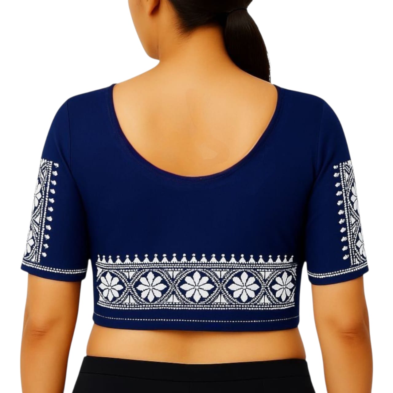 Navy blue blouse with white embroidery on a plain background